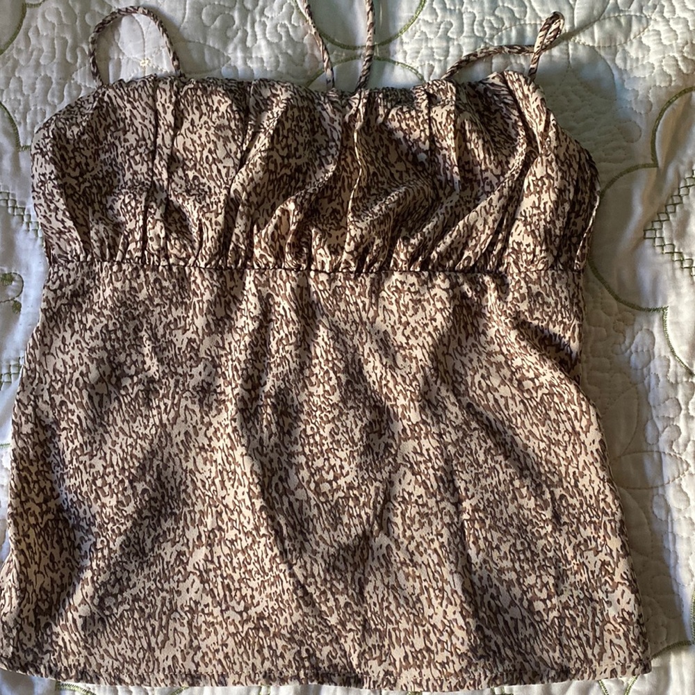 Brand New Top. It ties from the back. Size Large.
